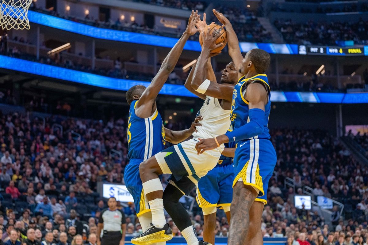 Dec 6, 2024; San Francisco, California, USA; Minnesota Timberwolves guard Anthony Edwards (5) shot is blocked by Golden State Warriors forward Jonathan Kuminga (00) and forward Draymond Green (23) during the second quarter at Chase Center. Mandatory Credit: Neville E. Guard-Imagn Images