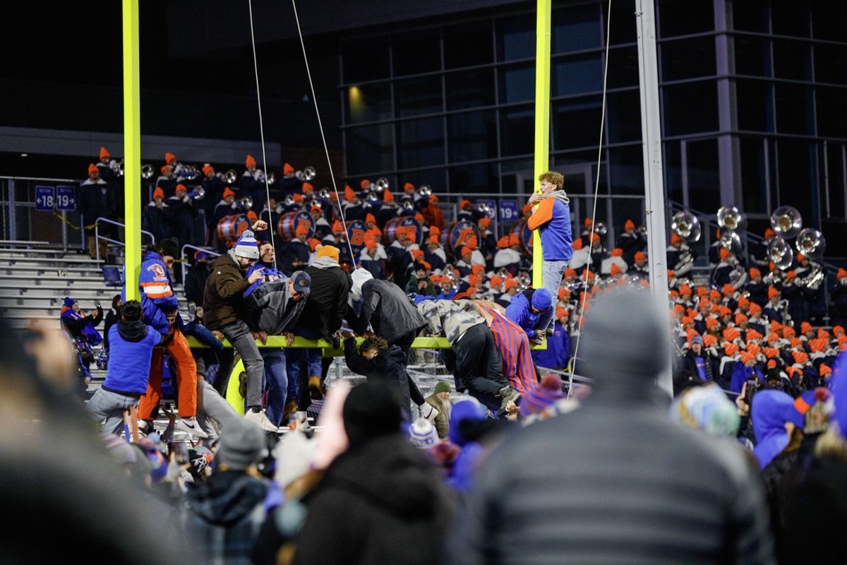 Dec 6, 2024; Boise, ID, USA; Boise State Broncos fans start to tear down the goal posts after the game against the UNLV Rebels at Albertsons Stadium. Boise State beats UNLV 21-7.   Mandatory Credit: Brian Losness-Imagn Images