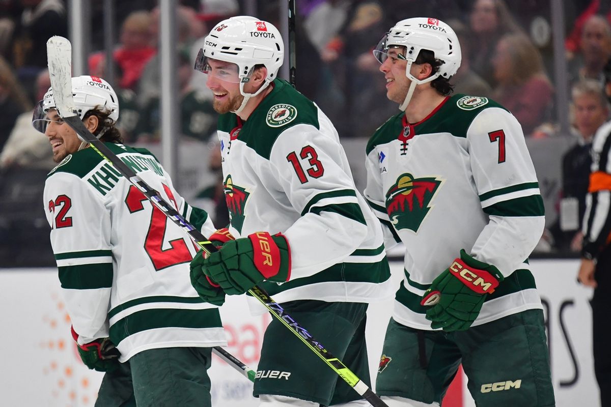 Dec 6, 2024; Anaheim, California, USA; Minnesota Wild center Yakov Trenin (13) celebrates his empty net goal scored against the Anaheim Ducks during the third period at Honda Center. Mandatory Credit: Gary A. Vasquez-Imagn Images