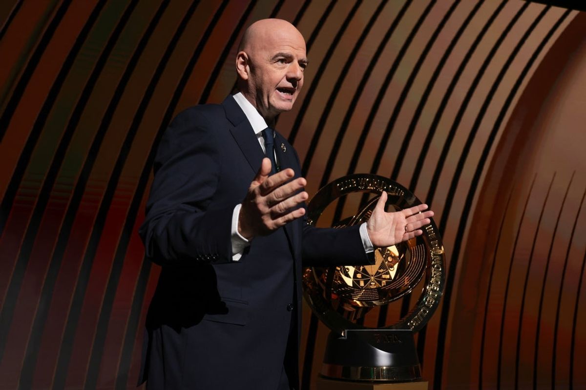Dec 5, 2024; Miami, FL, USA; FIFA president Gianni Infantino speaks in front of the 2025 FIFA Club World Cup trophy during the FIFA Club Word Cup draw at Telemundo Studios. Mandatory Credit: Sam Navarro-Imagn Images