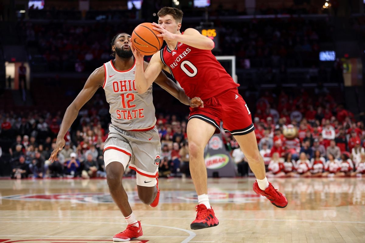 Dec 7, 2024; Columbus, Ohio, USA;  Rutgers Scarlet Knights guard Jordan Derkack (0) grabs the ball as Ohio State Buckeyes guard Evan Mahaffey (12) defends during the first half at Value City Arena. Mandatory Credit: Joseph Maiorana-Imagn Images