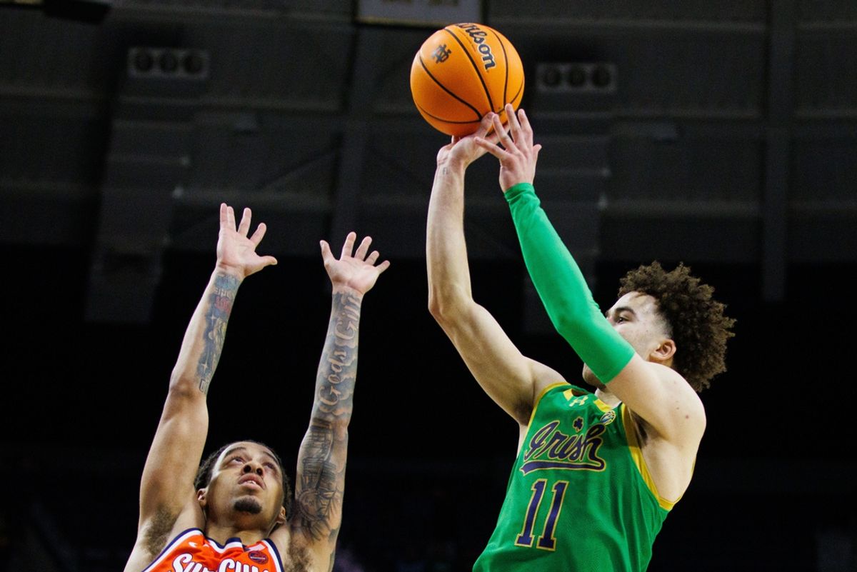 Notre Dame guard Braeden Shrewsberry (11) shoots over Syracuse guard Jaquan Carlos during a NCAA men's basketball game at Purcell Pavilion on Saturday, Dec. 7, 2024, in South Bend.