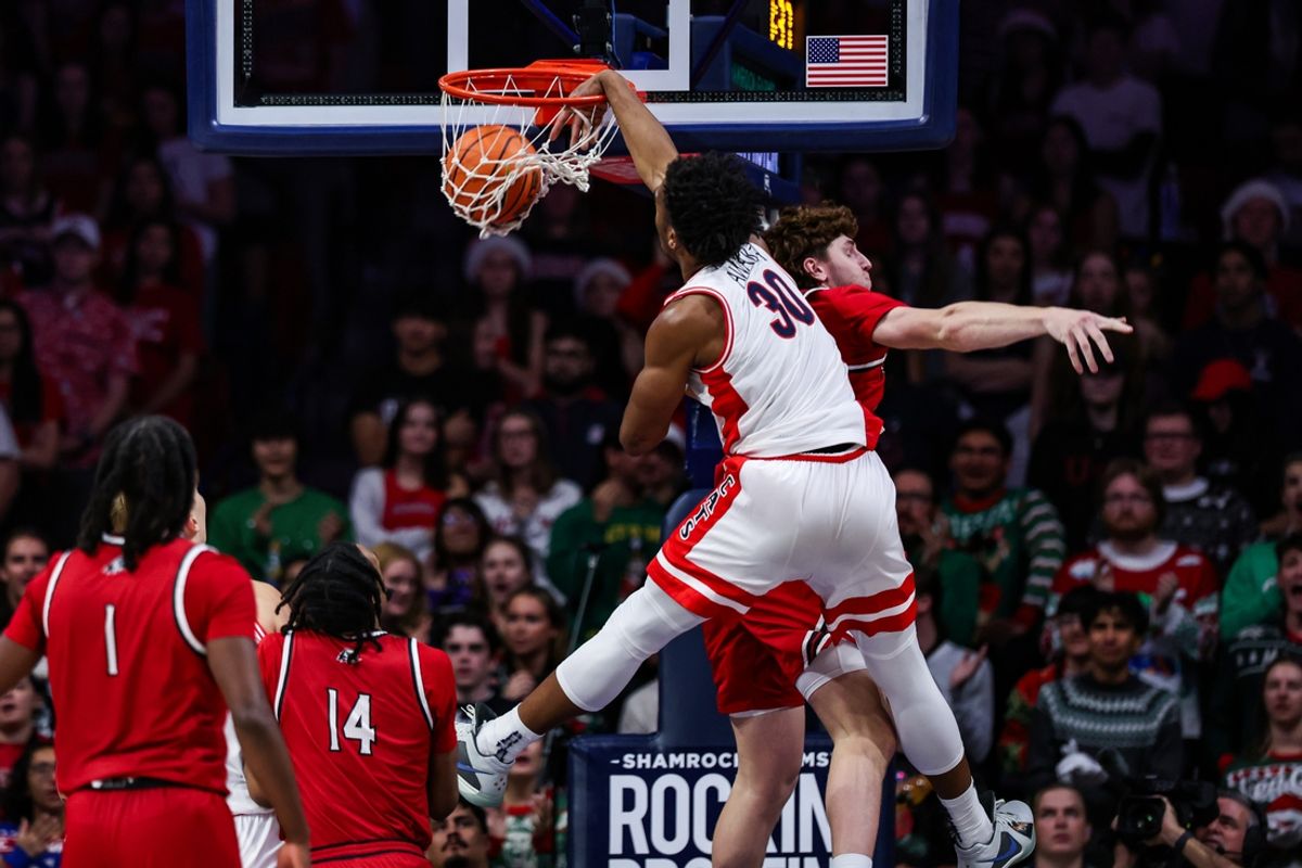 Dec 7, 2024; Tucson, Arizona, USA; Arizona Wildcats forward Tobe Awaka (30) dunks the ball over Southern Utah Thunderbirds power forward Brock Felder (33) during the first half at McKale Center. Mandatory Credit: Aryanna Frank-Imagn Images