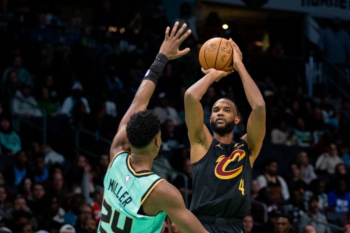 Dec 7, 2024; Charlotte, North Carolina, USA; Cleveland Cavaliers forward Evan Mobley (4) shoots over Charlotte Hornets forward Brandon Miller (24) during the third quarter at Spectrum Center. Mandatory Credit: Scott Kinser-Imagn Images