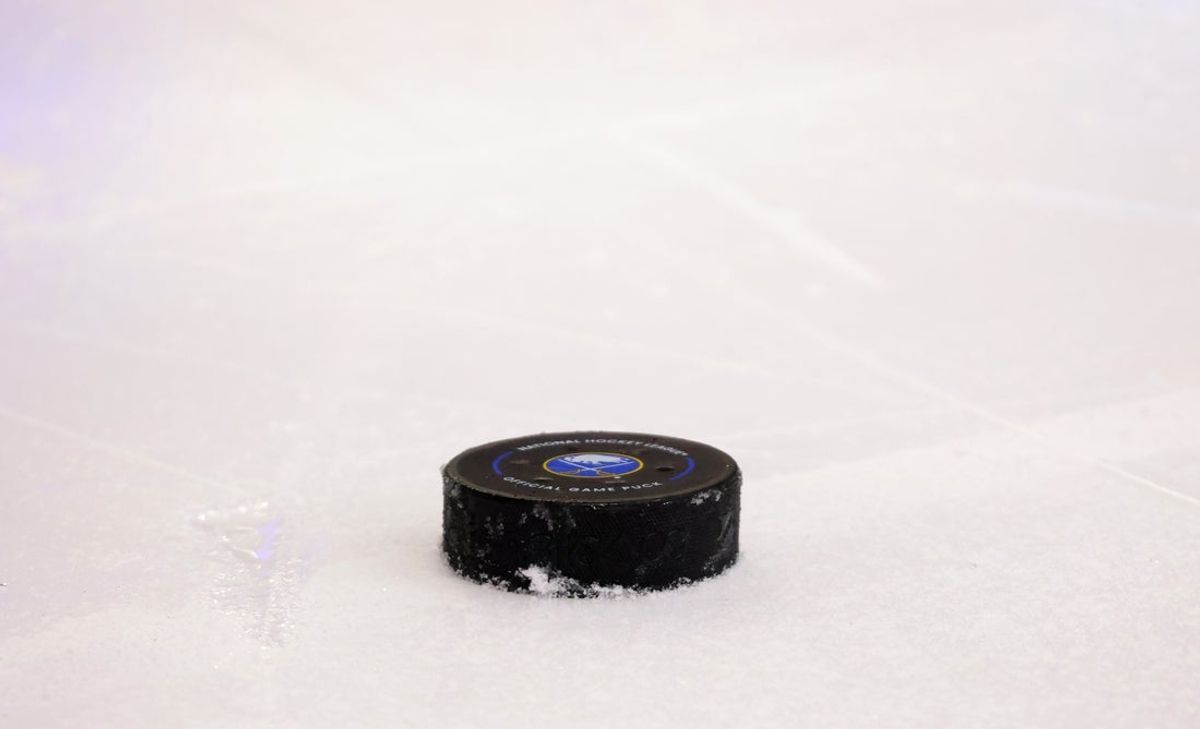 Dec 7, 2024; Buffalo, New York, USA;  A general view of the hockey puck used for a game between the Buffalo Sabres and the Utah Hockey Club at KeyBank Center. Mandatory Credit: Timothy T. Ludwig-Imagn Images