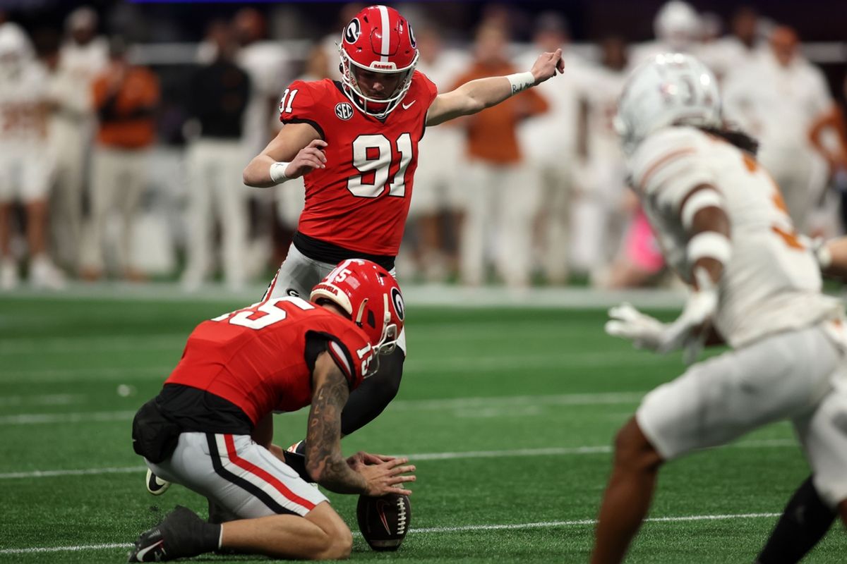 Dec 7, 2024; Atlanta, GA, USA; Georgia Bulldogs place kicker Peyton Woodring (91) kicks a field goal against the Texas Longhorns during the first half in the 2024 SEC Championship game at Mercedes-Benz Stadium. Mandatory Credit: Brett Davis-Imagn Images