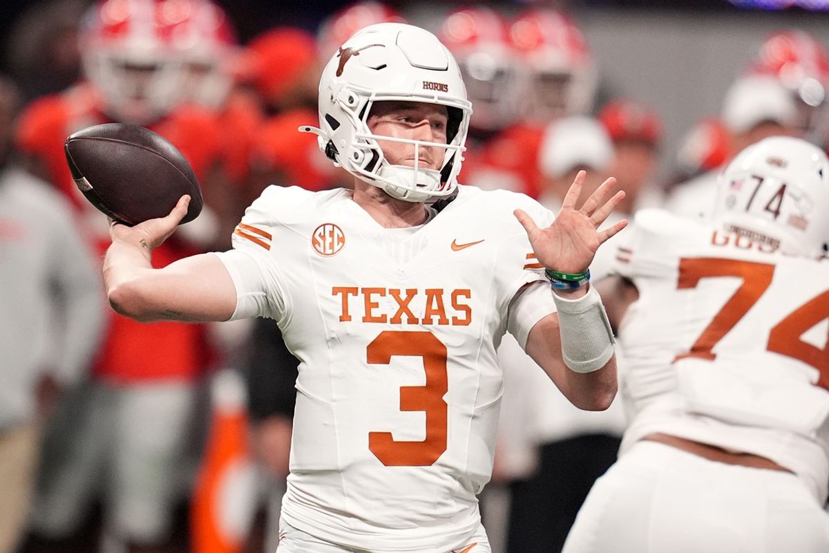 Dec 7, 2024; Atlanta, GA, USA; Texas Longhorns quarterback Quinn Ewers (3) drops back to pass against the Georgia Bulldogs during the first half in the 2024 SEC Championship game at Mercedes-Benz Stadium. Mandatory Credit: Dale Zanine-Imagn Images