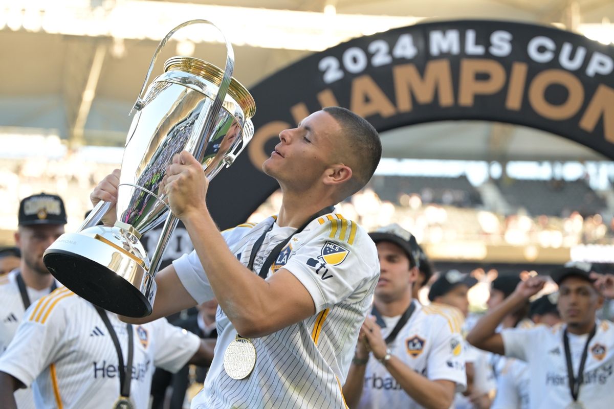 Dec 7, 2024; Carson, California, USA; LA Galaxy forward Dejan Joveljic (9) celebrates on the field with the Philip F. Anschutz trophy after defeating the New York Red Bulls in the 2024 MLS Cup at Dignity Health Sports Park. Mandatory Credit: Jayne Kamin-Oncea-Imagn Images
