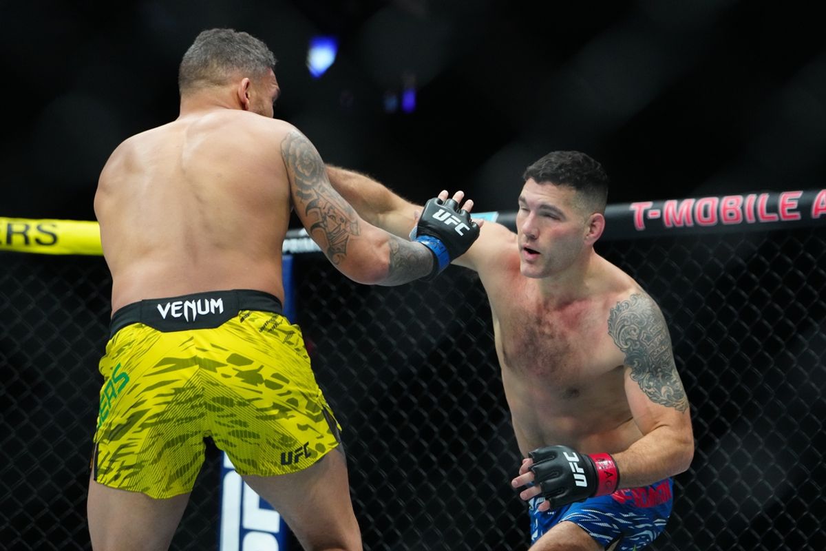 Dec 7, 2024; Las Vegas, Nevada, UNITED STATES; Chris Weidman (red gloves) fights Eryk Anders (blue gloves) at T-Mobile Arena. Mandatory Credit: Stephen R. Sylvanie-Imagn Images