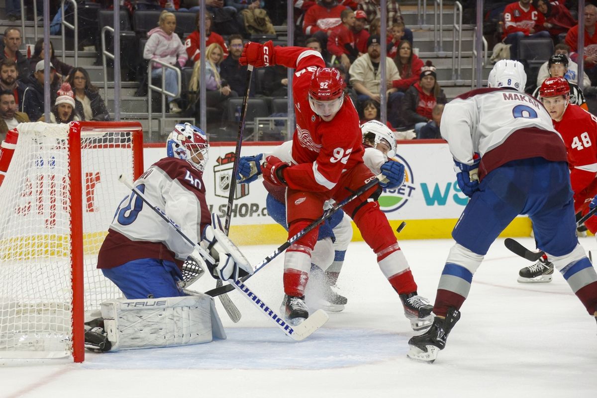 Dec 7, 2024; Detroit, Michigan, USA; Detroit Red Wings center Marco Kasper (92) brings the puck in front of the net against the Colorado Avalanche during the second period at Little Caesars Arena. Mandatory Credit: Brian Bradshaw Sevald-Imagn Images