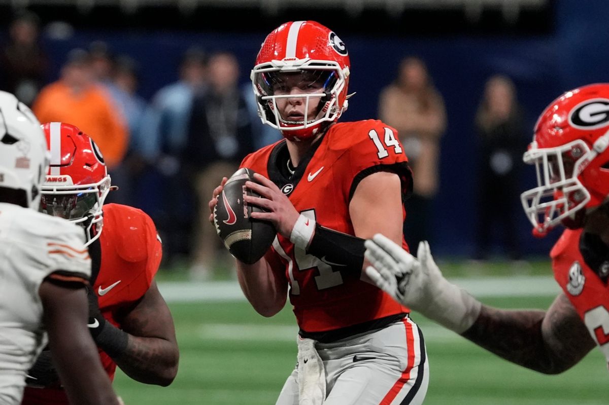 Georgia quarterback Gunner Stockton (14) looks to throw a pass during overtime of the SEC championship game against Texas in Atlanta, on Saturday, Dec. 7, 2024.