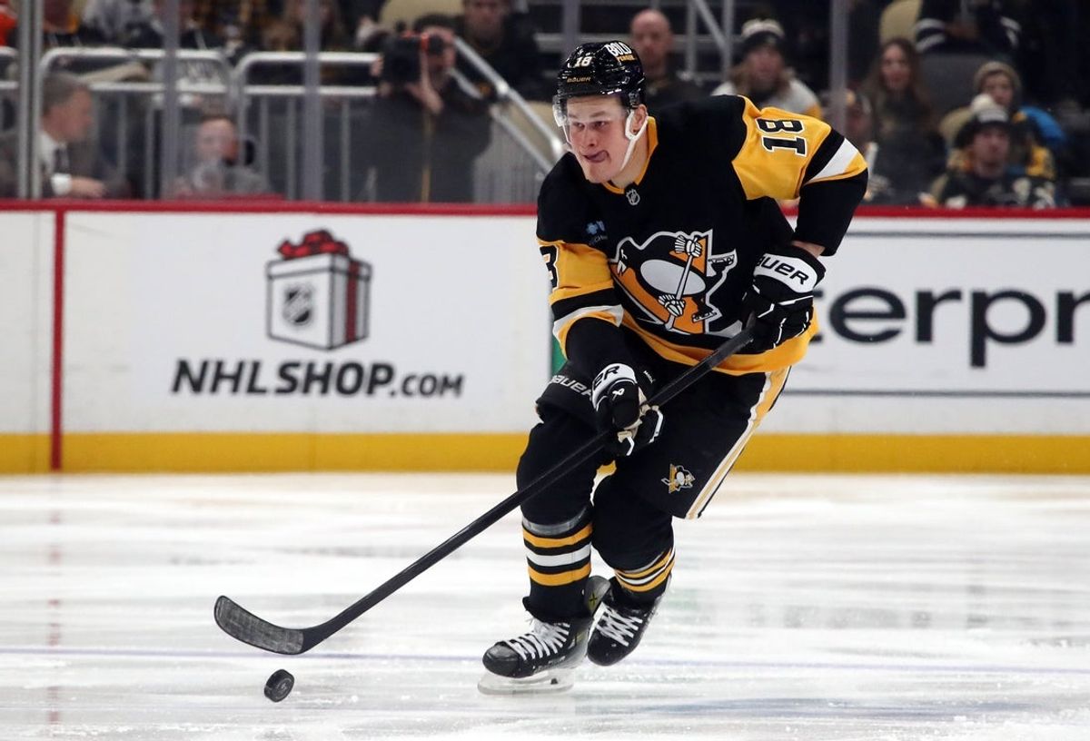 Dec 7, 2024; Pittsburgh, Pennsylvania, USA;  Pittsburgh Penguins right wing Jesse Puljujarvi (18) skates with the puck against the Toronto Maple Leafs during the third period at PPG Paints Arena. Mandatory Credit: Charles LeClaire-Imagn Images