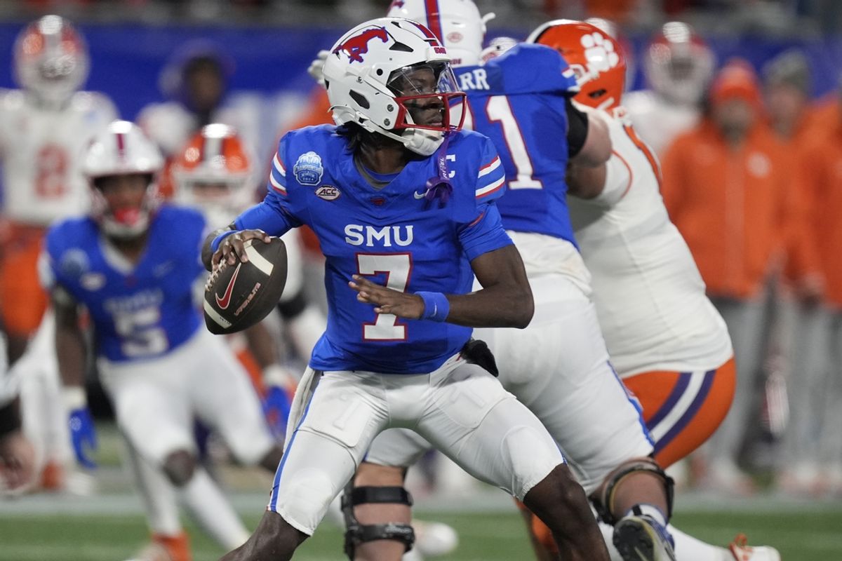 Dec 7, 2024; Charlotte, NC, USA; Southern Methodist Mustangs quarterback Kevin Jennings (7) throws during the second quarter against the Clemson Tigers in the 2024 ACC Championship game at Bank of America Stadium. Mandatory Credit: Jim Dedmon-Imagn Images
