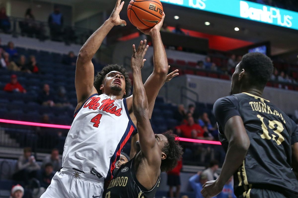 Dec 7, 2024; Oxford, Mississippi, USA; Mississippi Rebels forward Jaemyn Brakefield (4) shoots the ball against Lindenwood Lions guard Markeith Browning II (3) during the second half at The Sandy and John Black Pavilion at Ole Miss. Mandatory Credit: Petre Thomas-Imagn Images