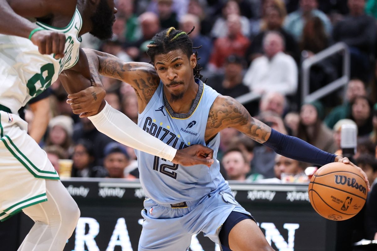 Dec 7, 2024; Boston, Massachusetts, USA; Memphis Grizzlies guard Ja Morant (12) drives to the basket during the second half against the Boston Celtics at TD Garden. Mandatory Credit: Paul Rutherford-Imagn Images
