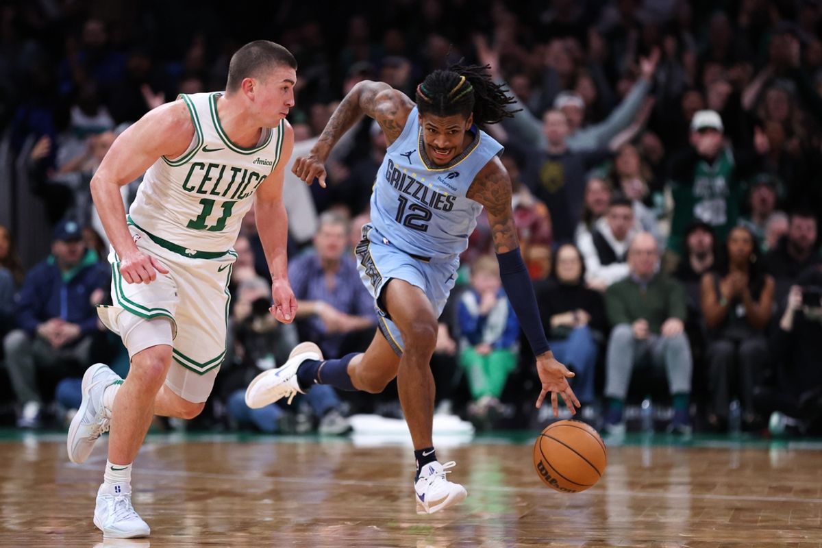 Dec 7, 2024; Boston, Massachusetts, USA; Memphis Grizzlies guard Ja Morant (12) dribbles down the court during the second half against the Boston Celtics at TD Garden. Mandatory Credit: Paul Rutherford-Imagn Images