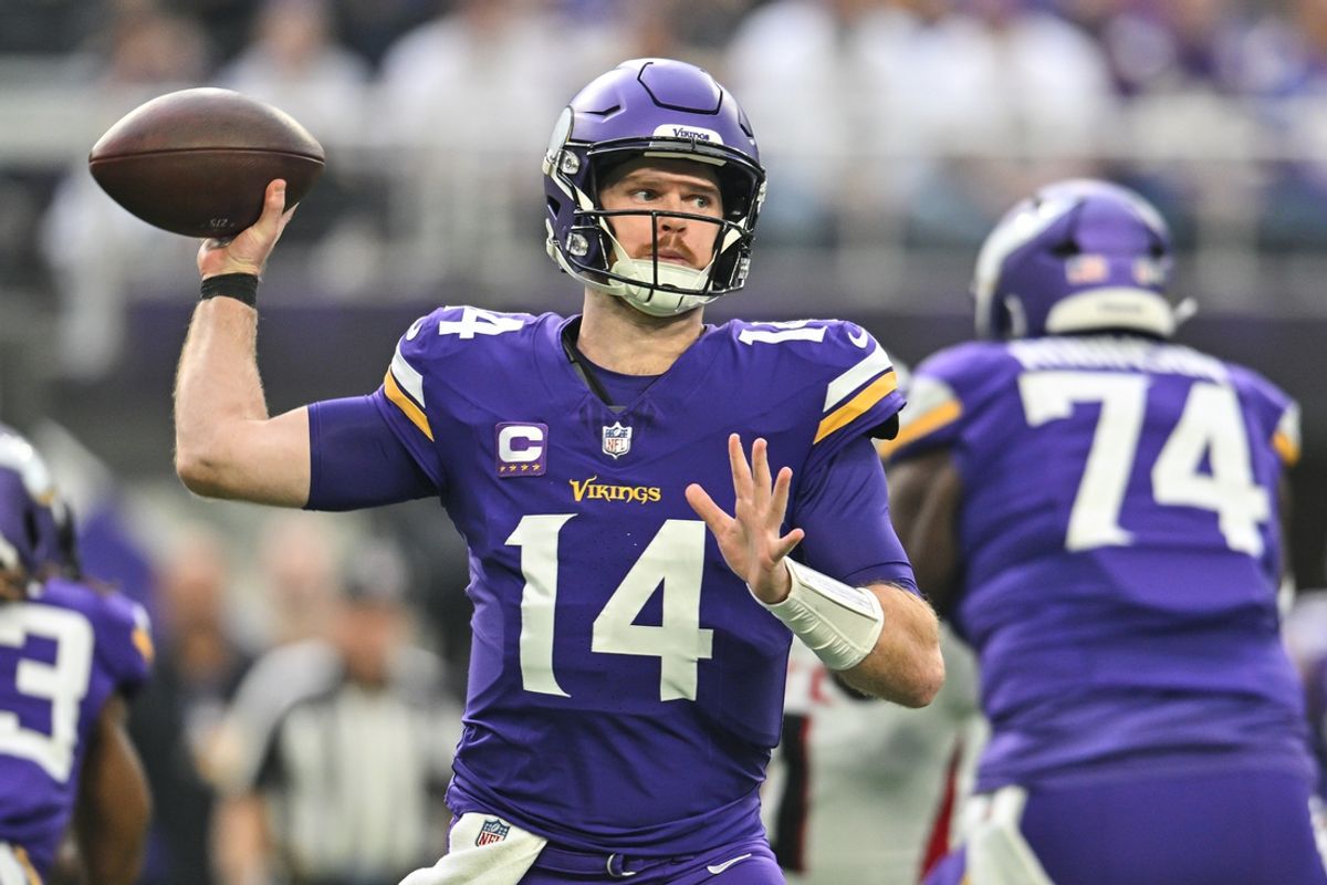 Dec 8, 2024; Minneapolis, Minnesota, USA; Minnesota Vikings quarterback Sam Darnold (14) throws a pass against the Atlanta Falcons during the first quarter at U.S. Bank Stadium. Mandatory Credit: Jeffrey Becker-Imagn Images