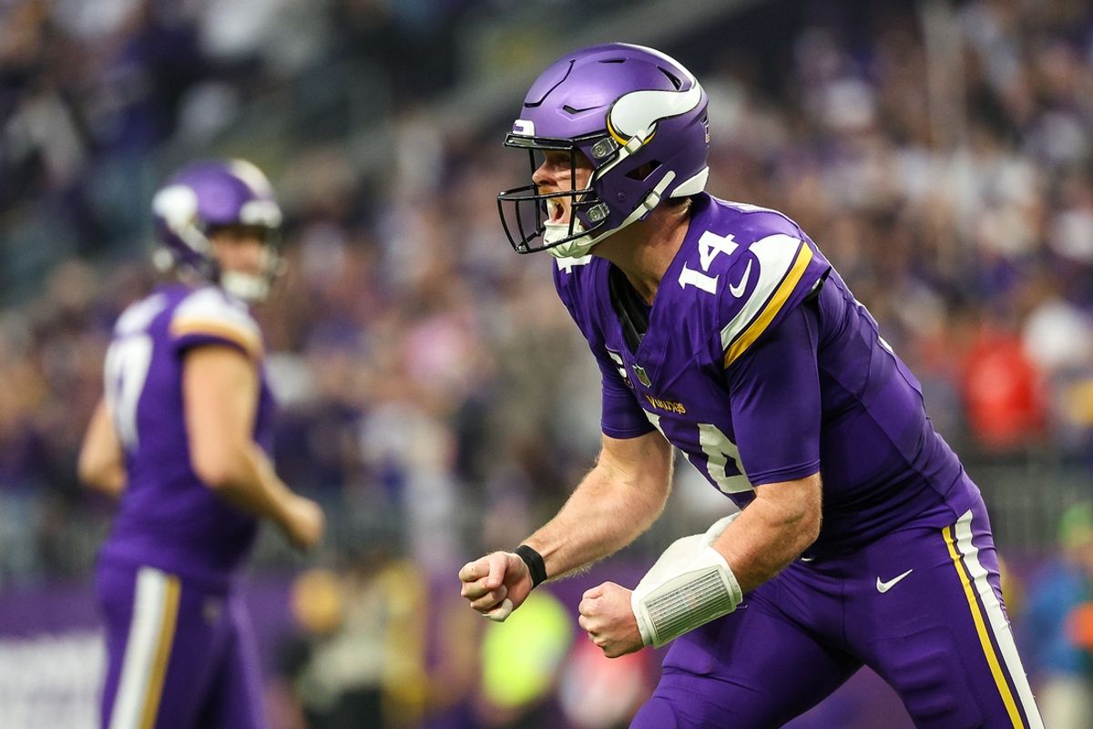 Dec 8, 2024; Minneapolis, Minnesota, USA; Minnesota Vikings quarterback Sam Darnold (14) celebrates his touchdown to wide receiver Jordan Addison (3) during the fourth quarter against the Atlanta Falcons at U.S. Bank Stadium. Mandatory Credit: Matt Krohn-Imagn Images
