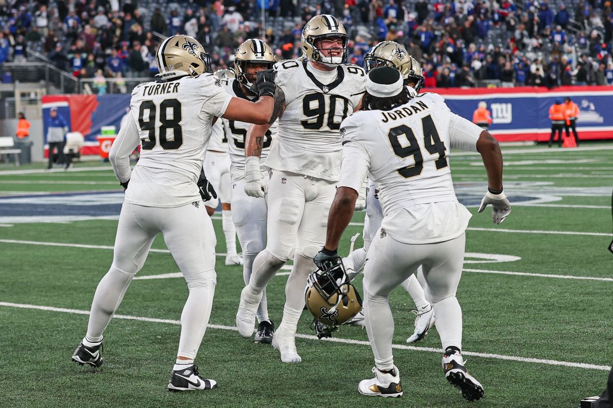 Dec 8, 2024; East Rutherford, New Jersey, USA; New Orleans Saints defensive tackle Bryan Bresee (90) celebrates with teammates after blocking a field goal during the fourth quarter by New York Giants place kicker Graham Gano (not pictured) at MetLife Stadium. Mandatory Credit: Vincent Carchietta-Imagn Images