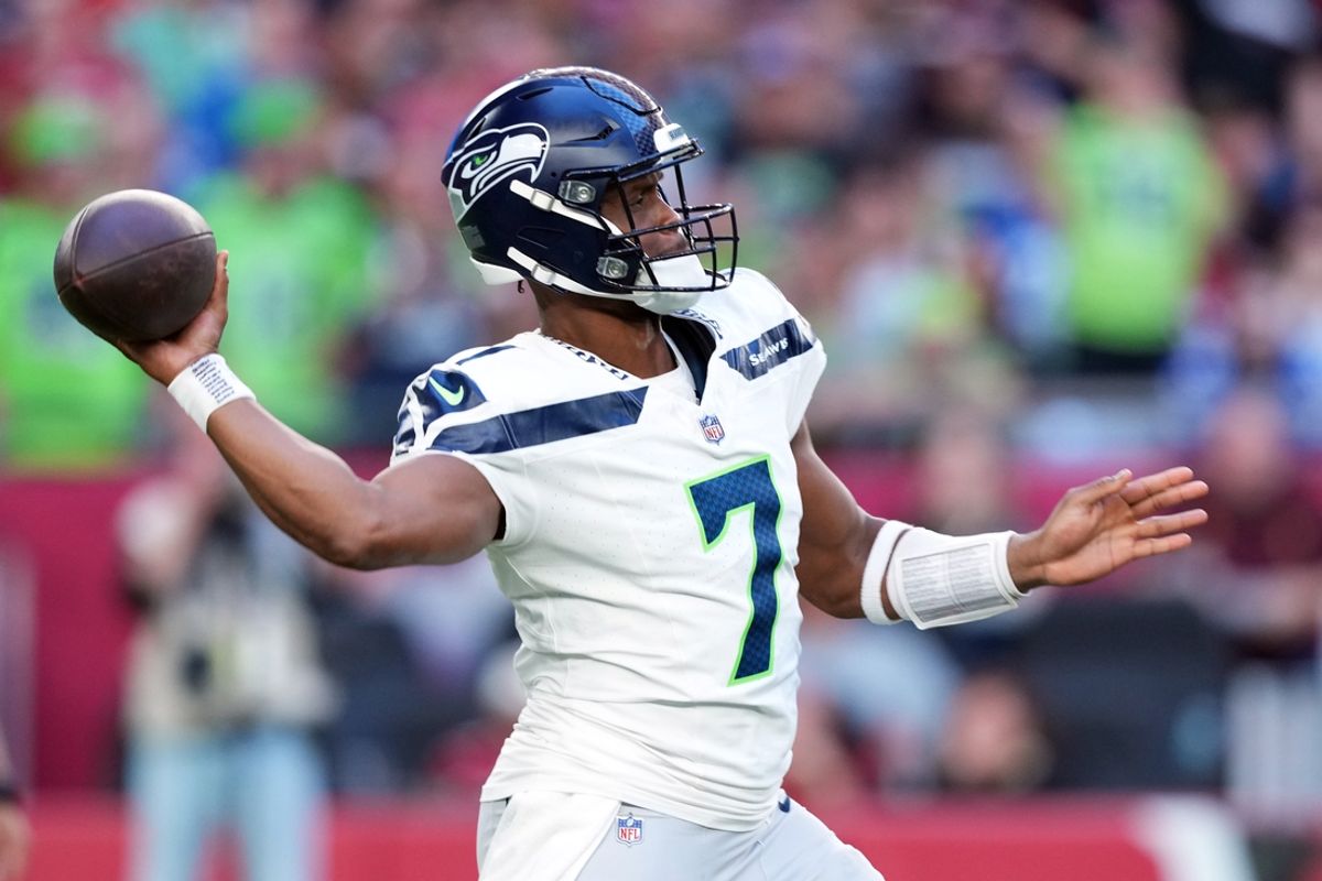 Dec 8, 2024; Glendale, Arizona, USA; Seattle Seahawks quarterback Geno Smith (7) throws against the Arizona Cardinals during the second half at State Farm Stadium. Mandatory Credit: Joe Camporeale-Imagn Images