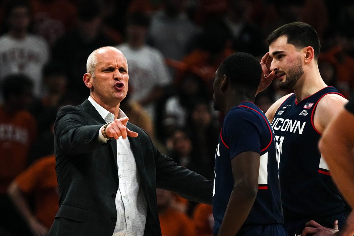 University of Connecticut head coach Dan Hurley talks to guard Hassan Diarra (10) and forward Alex Karaban (11) during the game against the Texas Longhorns at the Moody Center on Sunday, Dec. 8, 2024.