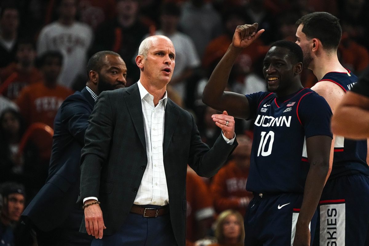 University of Connecticut head coach Dan Hurley talks to guard Hassan Diarra (10) during the game against the Texas Longhorns at the Moody Center on Sunday, Dec. 8, 2024.
