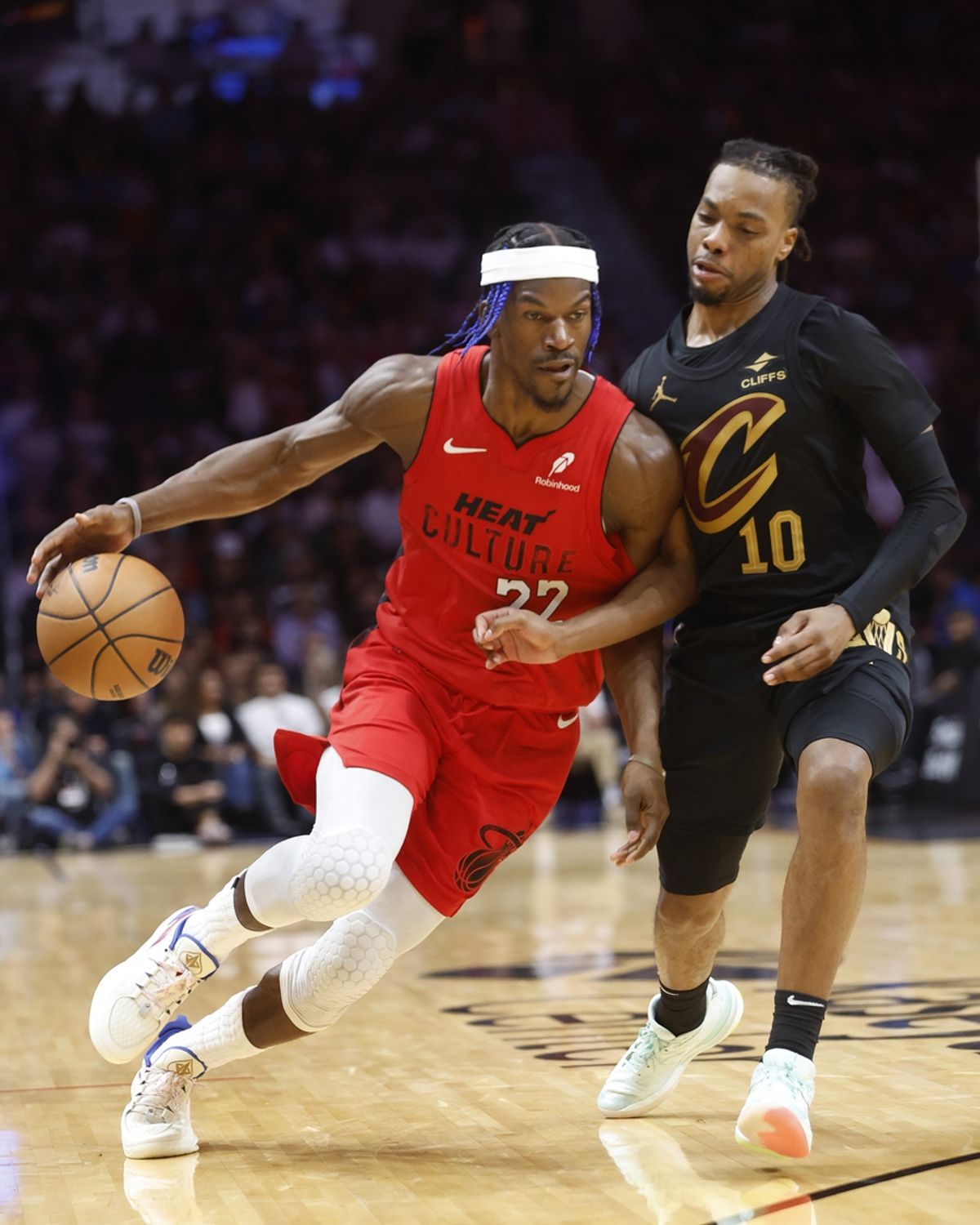 Dec 8, 2024; Miami, Florida, USA;  Cleveland Cavaliers guard Darius Garland (10) defends Miami Heat forward Jimmy Butler (22) during the second half at Kaseya Center. Mandatory Credit: Rhona Wise-Imagn Images