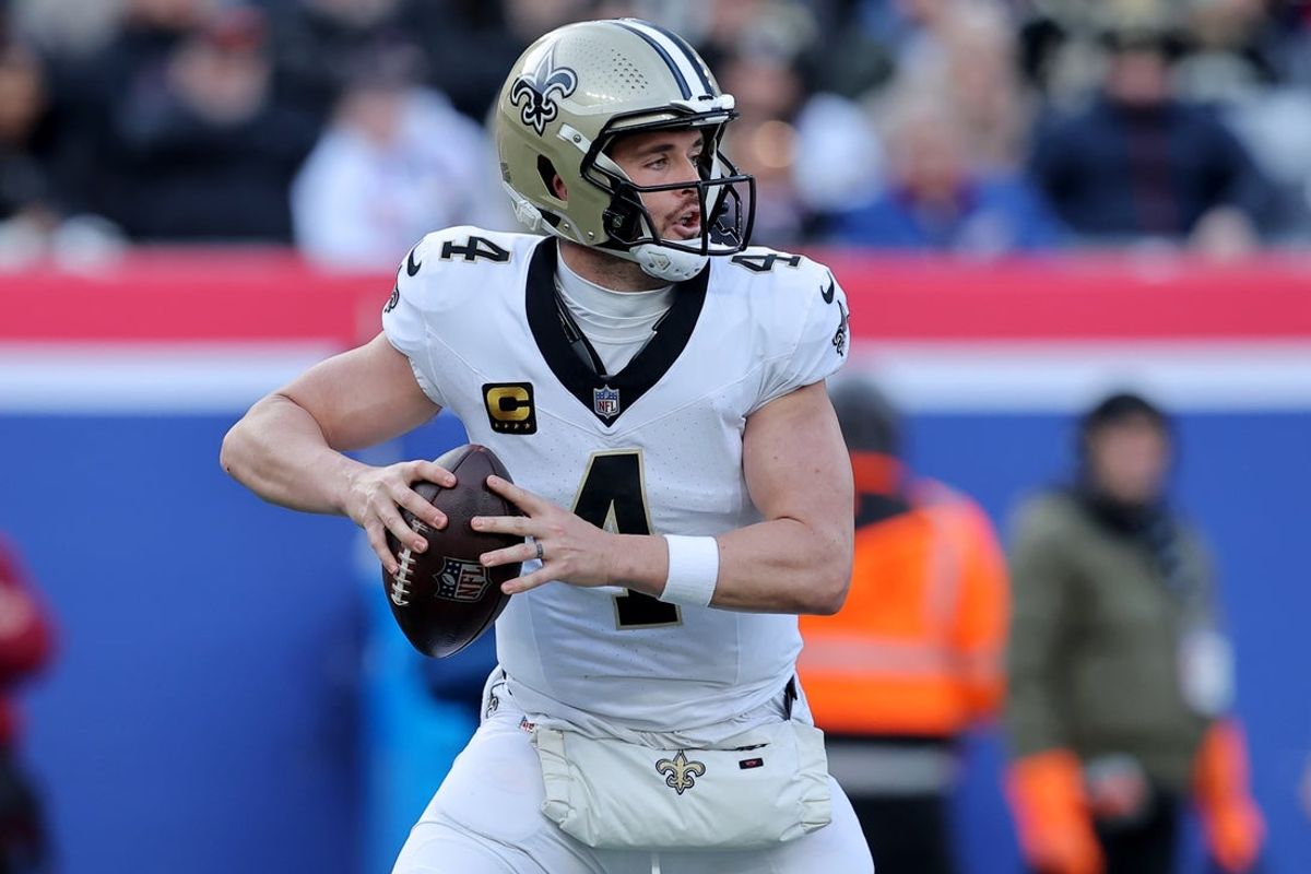 Dec 8, 2024; East Rutherford, New Jersey, USA; New Orleans Saints quarterback Derek Carr (4) drops back to pass against the New York Giants during the first quarter at MetLife Stadium. Mandatory Credit: Brad Penner-Imagn Images