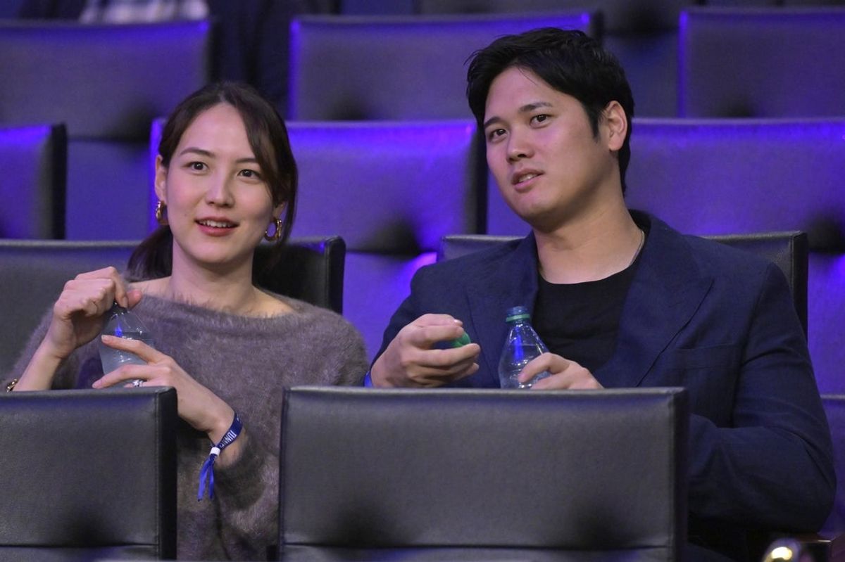 Dec 8, 2024; Los Angeles, California, USA;  Los Angeles Dodgers Shohei Ohtani (17) and his wife Mamiko Tanaka attends the game between the Los Angeles Lakers and the Portland Trail Blazers at Crypto.com Arena. Mandatory Credit: Jayne Kamin-Oncea-Imagn Images