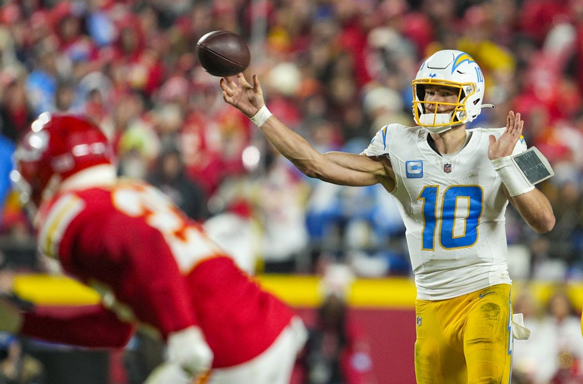 Dec 8, 2024; Kansas City, Missouri, USA; Los Angeles Chargers quarterback Justin Herbert (10) throws a pass during the second half against the Kansas City Chiefs at GEHA Field at Arrowhead Stadium. Mandatory Credit: Jay Biggerstaff-Imagn Images