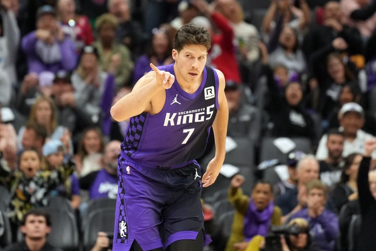 Dec 8, 2024; Sacramento, California, USA; Sacramento Kings forward Doug McDermott (7) gestures after making a three point basket against the Utah Jazz during the fourth quarter at Golden 1 Center. Mandatory Credit: Darren Yamashita-Imagn Images