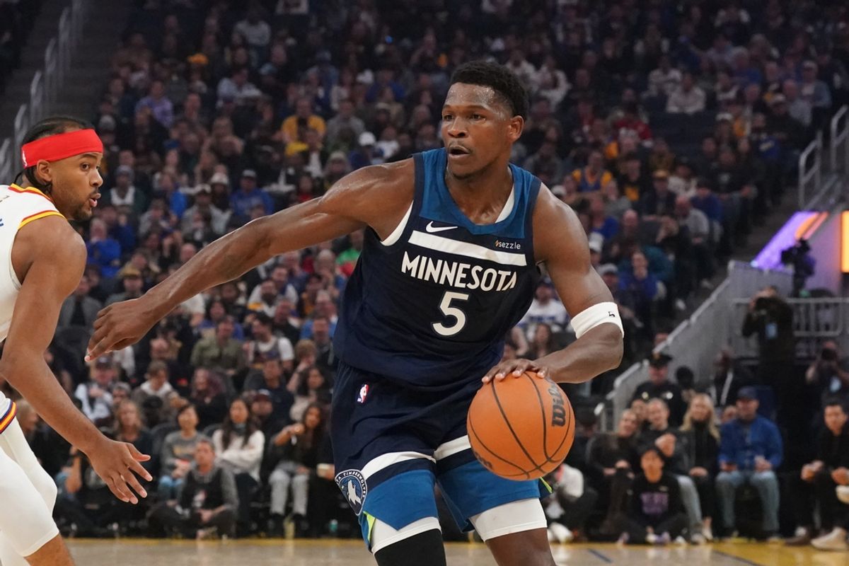 Dec 8, 2024; San Francisco, California, USA;  Minnesota Timberwolves guard Anthony Edwards (5) drives to the basket against Golden State Warriors guard Moses Moody (4) in the first period at Chase Center. Mandatory Credit: David Gonzales-Imagn Images
