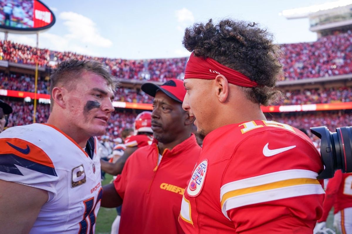 Nov 10, 2024; Kansas City, Missouri, USA; Kansas City Chiefs quarterback Patrick Mahomes (15) greets Denver Broncos quarterback Bo Nix (10) after the game at GEHA Field at Arrowhead Stadium. Mandatory Credit: Denny Medley-Imagn Images