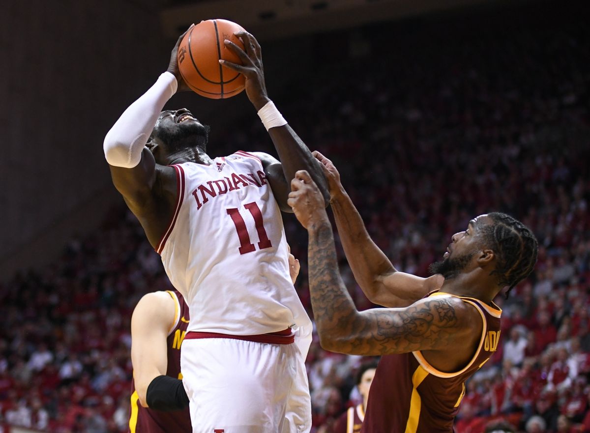 Dec 9, 2024; Bloomington, Indiana, USA; Indiana Hoosiers center Oumar Ballo (11) is fouled by Minnesota Golden Gophers guard Femi Odukale (11) during the first half at Simon Skjodt Assembly Hall. Mandatory Credit: Robert Goddin-Imagn Images