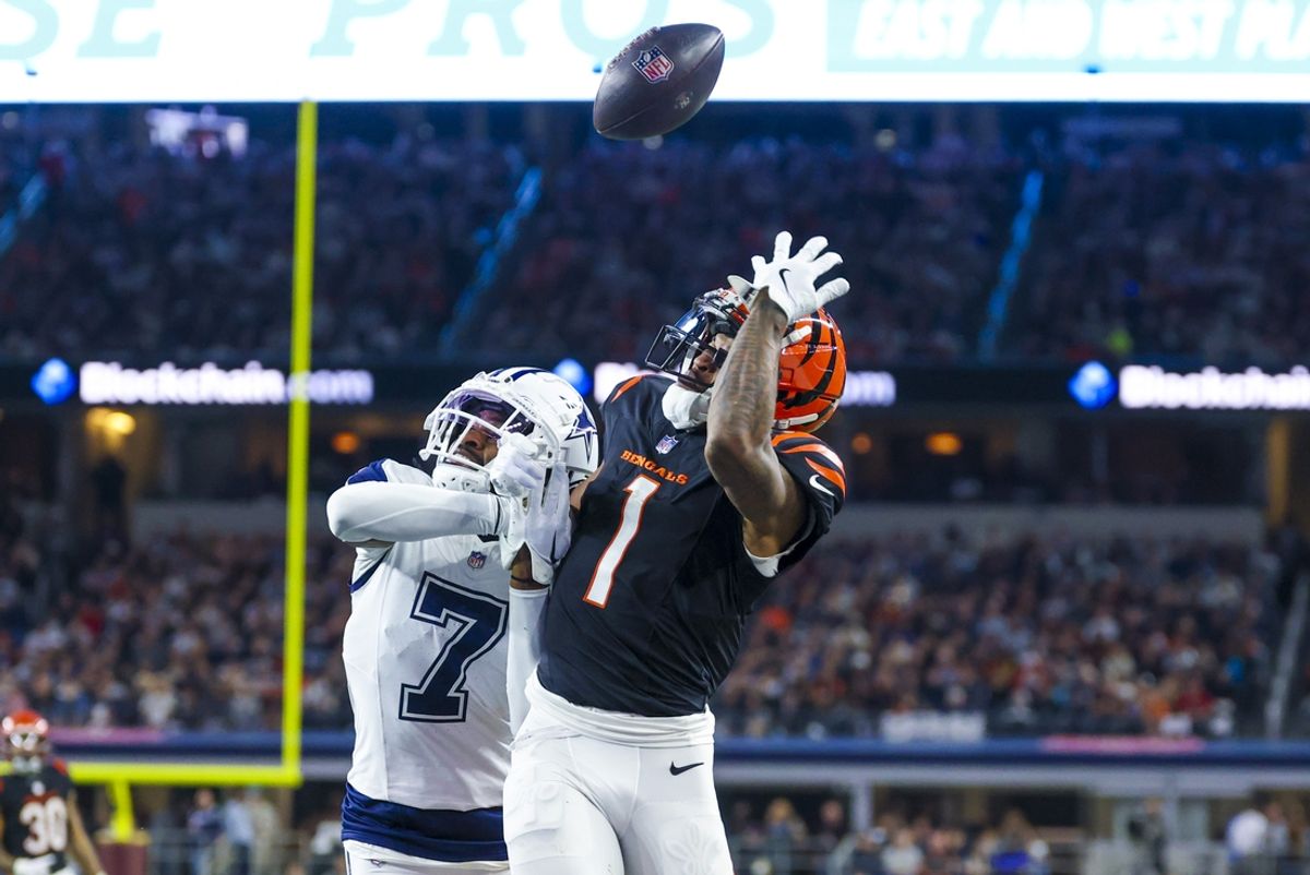 Dec 9, 2024; Arlington, Texas, USA;  Dallas Cowboys cornerback Trevon Diggs (7) defends a pass intended for Cincinnati Bengals wide receiver Ja'Marr Chase (1) during the first half at AT&T Stadium. Mandatory Credit: Kevin Jairaj-Imagn Images