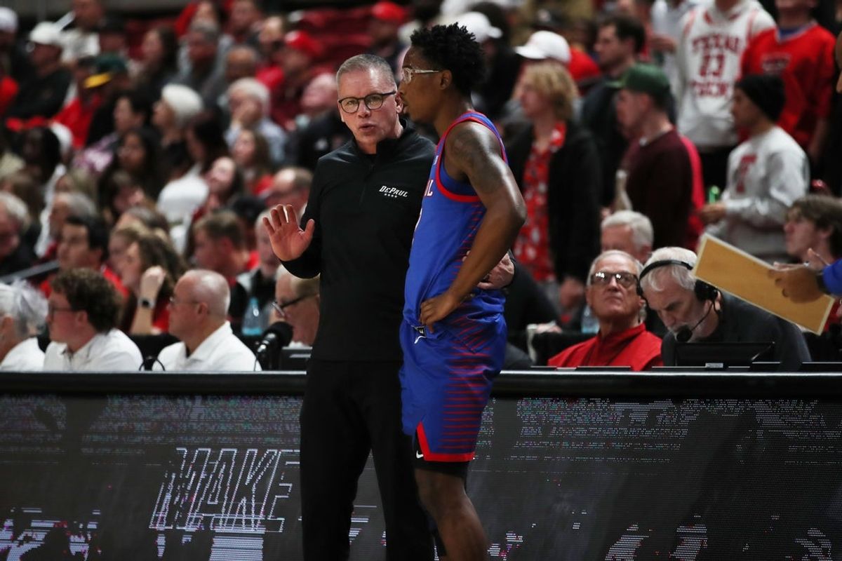 Dec 4, 2024; Lubbock, Texas, USA;  DePaul Blue Demons head coach Chris Holtman gives instructions in the second half to guard Layden Blocker (2) in the game against the Texas Tech Red Raiders at United Supermarkets Arena. Mandatory Credit: Michael C. Johnson-Imagn Images