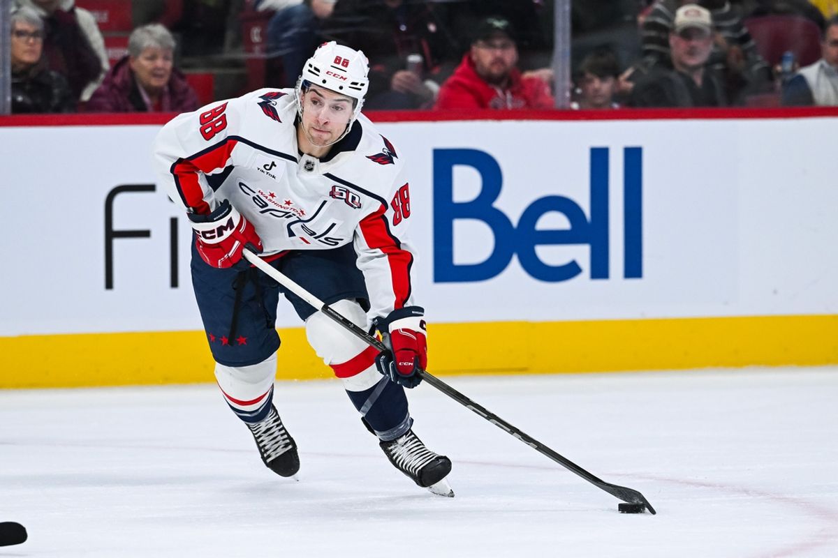 Dec 7, 2024; Montreal, Quebec, CAN; Washington Capitals left wing Andrew Mangiapane (88) plays the puck against the Montreal Canadiens during the first period at Bell Centre. Mandatory Credit: David Kirouac-Imagn Images