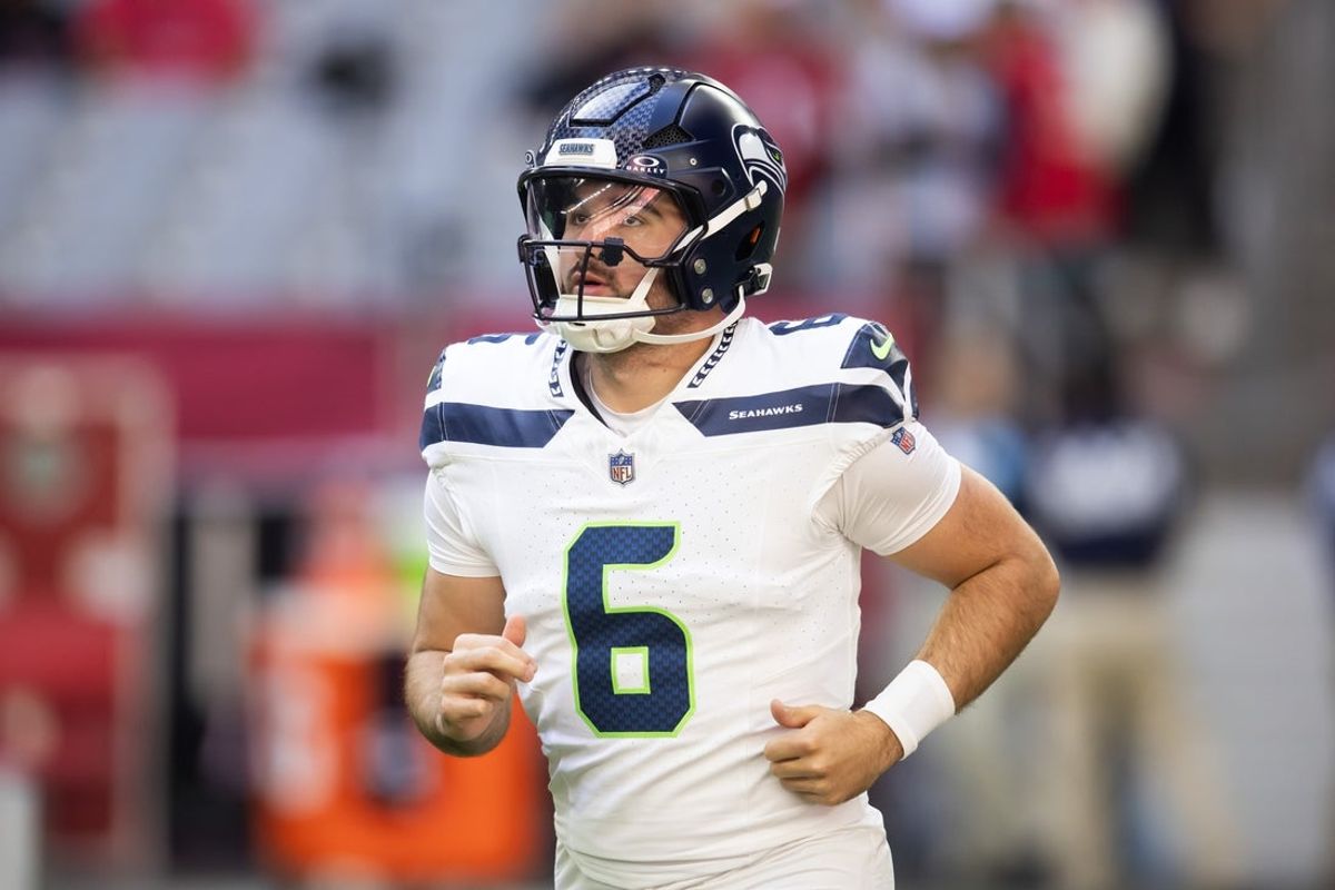 Dec 8, 2024; Glendale, Arizona, USA; Seattle Seahawks quarterback Sam Howell (6) against the Arizona Cardinals at State Farm Stadium. Mandatory Credit: Mark J. Rebilas-Imagn Images