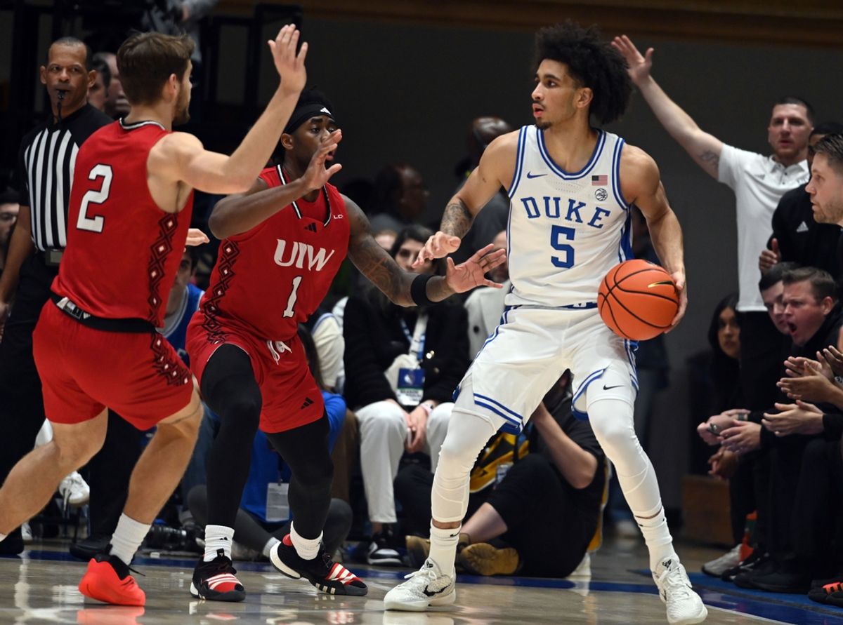 Dec 10, 2024; Durham, North Carolina, USA;  Duke Blue Devils guard Tyrese Proctor (5) looks to pass as Incarnate Word Cardinals forward Dylan Hayman (2) and Incarnate Word Cardinals guard Jalin Anderson (1) defend during the first half at Cameron Indoor Stadium. Mandatory Credit: Rob Kinnan-Imagn Images