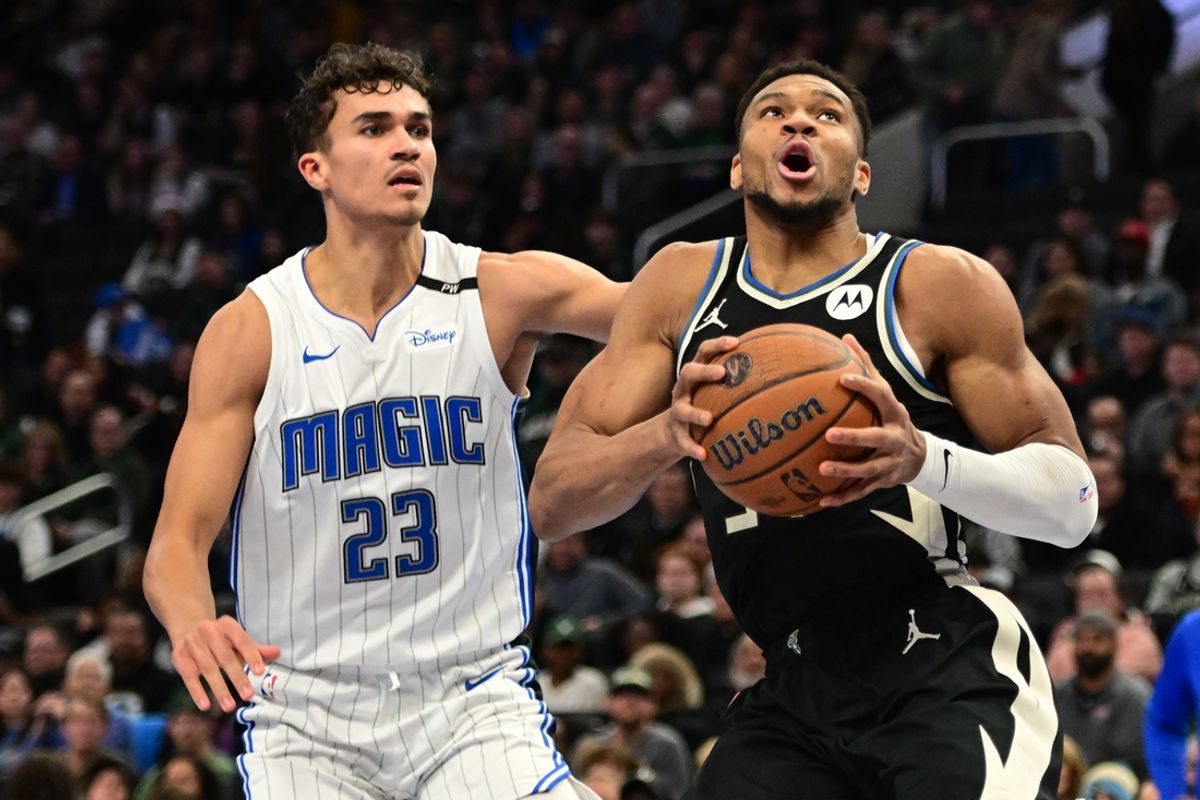 Dec 10, 2024; Milwaukee, Wisconsin, USA; Milwaukee Bucks forward Giannis Antetokounmpo (34) looks for a shot against Orlando Magic forward Tristan da Silva (23) in the second quarter at Fiserv Forum. Mandatory Credit: Benny Sieu-Imagn Images