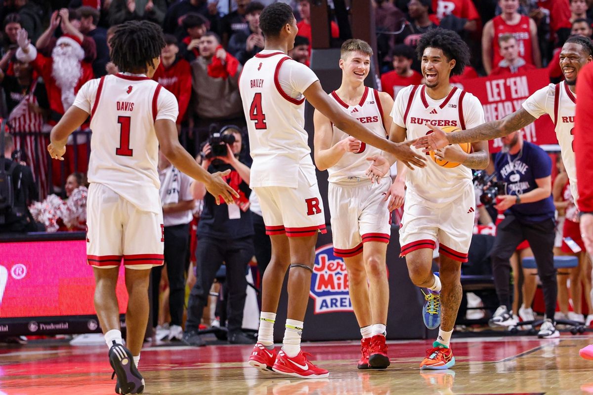 Dec 10, 2024; Piscataway, New Jersey, USA; Rutgers Scarlet Knights guard Dylan Harper (2) and guard Ace Bailey (4) celebrate after defeating the Penn State Nittany Lions at Jersey Mike's Arena. Mandatory Credit: Vincent Carchietta-Imagn Images