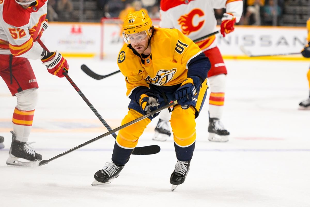 Dec 10, 2024; Nashville, Tennessee, USA;  Nashville Predators center Jonathan Marchessault (81) skates with the puck against the Calgary Flames during the third period at Bridgestone Arena. Mandatory Credit: Steve Roberts-Imagn Images