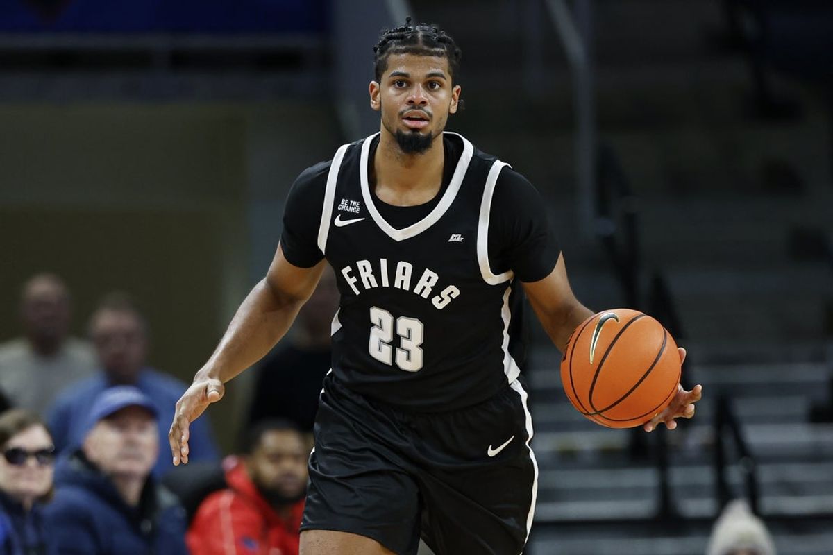 Dec 10, 2024; Chicago, Illinois, USA; Providence Friars forward Bryce Hopkins (23) brings the ball up court against the DePaul Blue Demons during the second half at Wintrust Arena. Mandatory Credit: Kamil Krzaczynski-Imagn Images