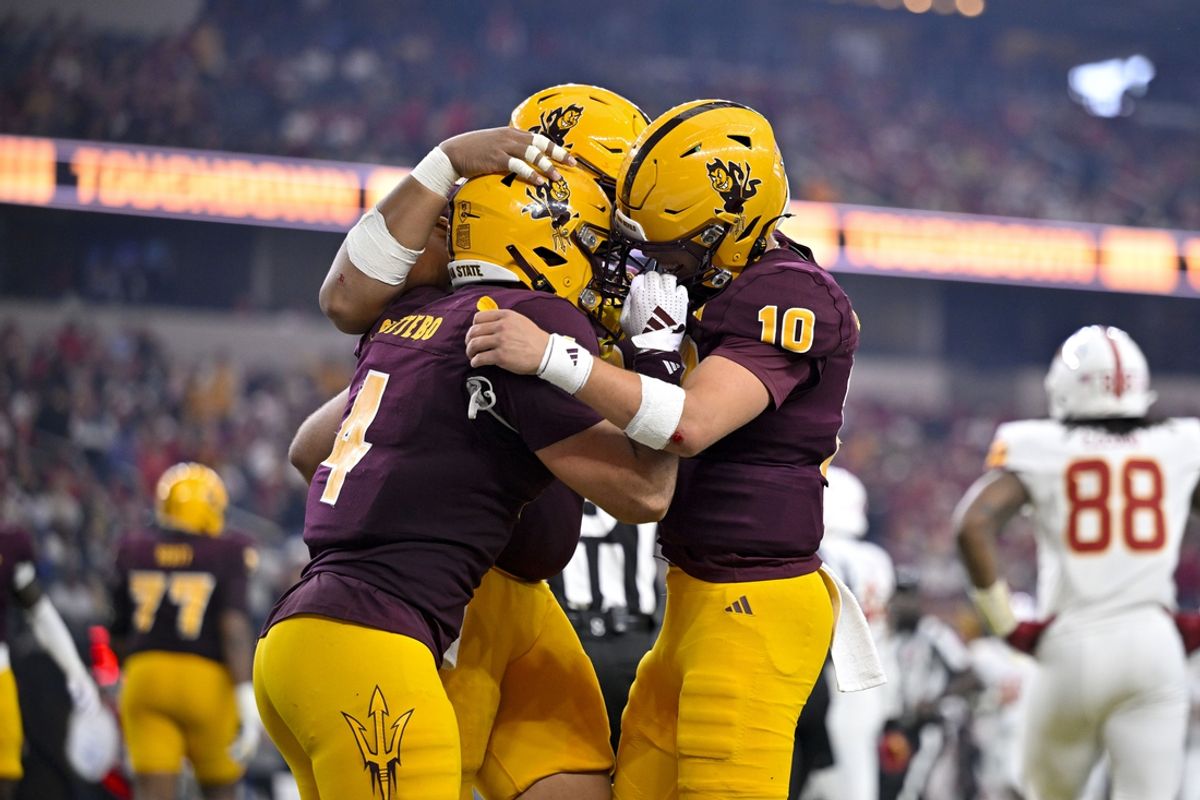Dec 7, 2024; Arlington, TX, USA; Arizona State Sun Devils running back Cam Skattebo (4) and offensive lineman Leif Fautanu (79) and quarterback Sam Leavitt (10) celebrate during the game between the Iowa State Cyclones and the Arizona State Sun Devils at AT&T Stadium. Mandatory Credit: Jerome Miron-Imagn Images