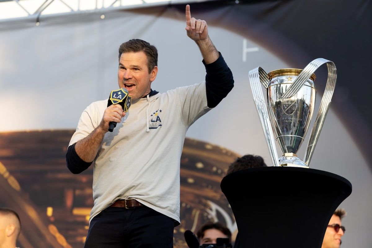 Dec 8, 2024; Carson, California, USA; Greg Vanney head coach of the LA Galaxy celebrates with the Philip F. Anschutz trophy during the champions celebration after winning the 2024 MLS Cup against the New York Red Bulls at Dignity Health Sports Park. at Dignity Health Sports Park. Mandatory Credit: Bailey Holiver-Imagn Images