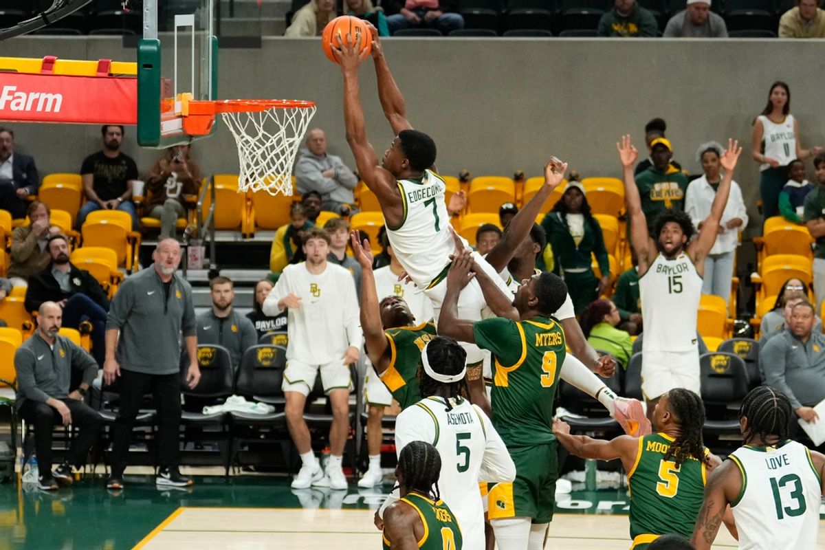 Dec 11, 2024; Waco, Texas, USA;  Baylor Bears guard VJ Edgecombe (7) dunks the ball against the Norfolk State Spartans during the second half at Paul and Alejandra Foster Pavilion. Mandatory Credit: Chris Jones-Imagn Images