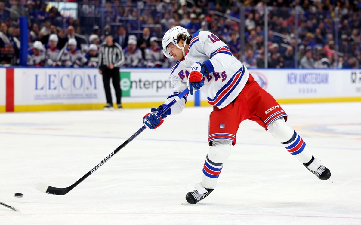 Dec 11, 2024; Buffalo, New York, USA;  New York Rangers left wing Artemi Panarin (10) takes a shot on goal during the first period against the Buffalo Sabres at KeyBank Center. Mandatory Credit: Timothy T. Ludwig-Imagn Images