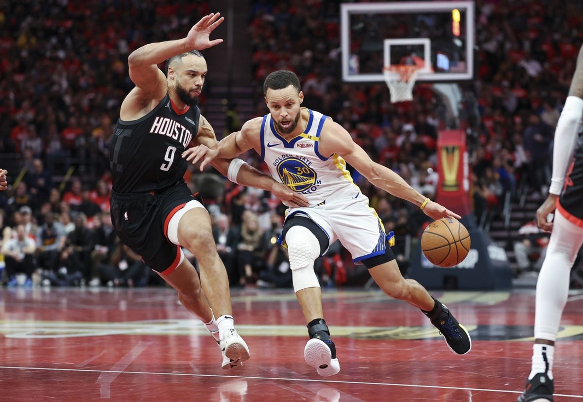 Dec 11, 2024; Houston, Texas, USA; Golden State Warriors guard Stephen Curry (30) drives with the ball as Houston Rockets forward Dillon Brooks (9) defends during the first quarter at Toyota Center. Mandatory Credit: Troy Taormina-Imagn Images