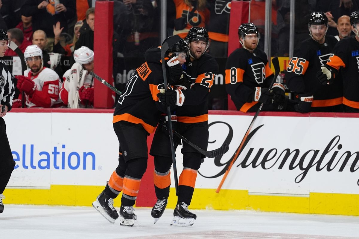Dec 12, 2024; Philadelphia, Pennsylvania, USA; Philadelphia Flyers center Scott Laughton (21) celebrates with center Ryan Poehling (25) after scoring a goal against the Detroit Red Wings in the second period at Wells Fargo Center. Mandatory Credit: Kyle Ross-Imagn Images
