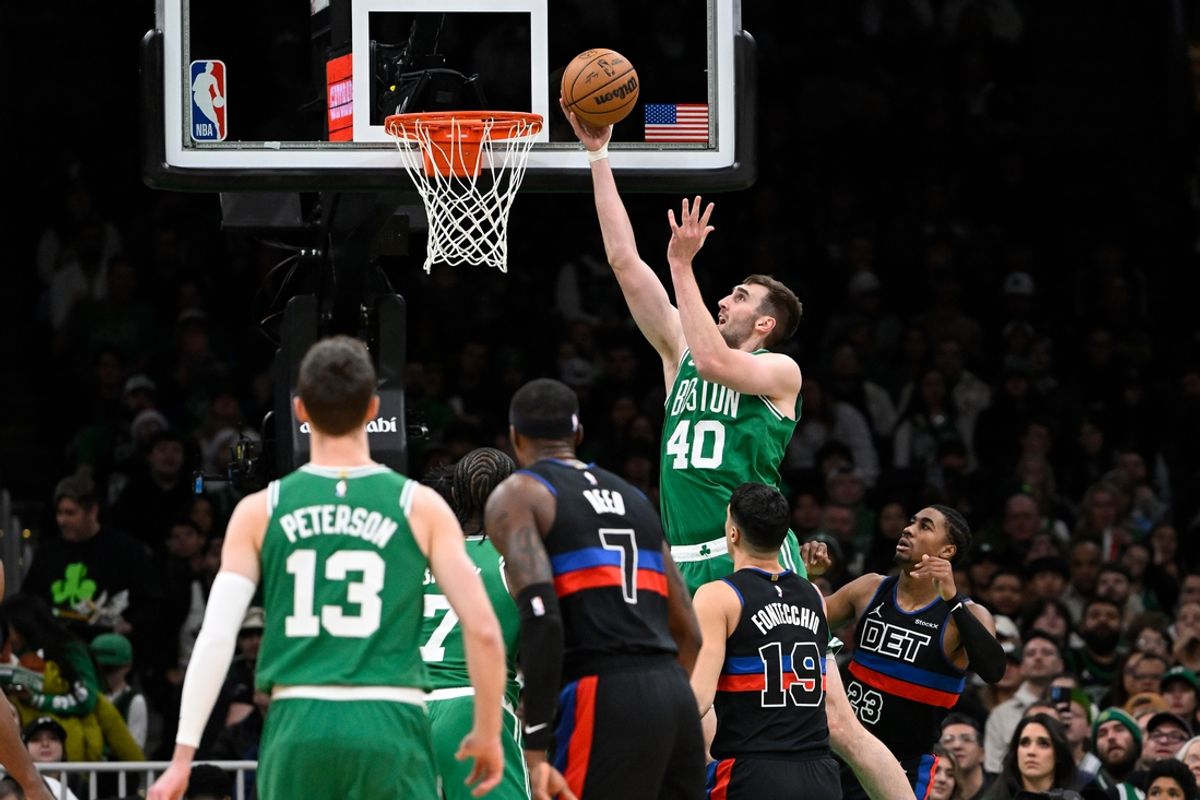 Dec 12, 2024; Boston, Massachusetts, USA;  Boston Celtics center Luke Kornet (40) shoots against the Detroit Pistons during the first half at TD Garden. Mandatory Credit: Eric Canha-Imagn Images